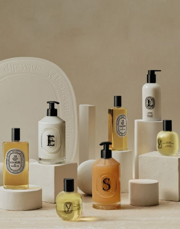 Various bottles of Diptyque cosmetics and perfumes