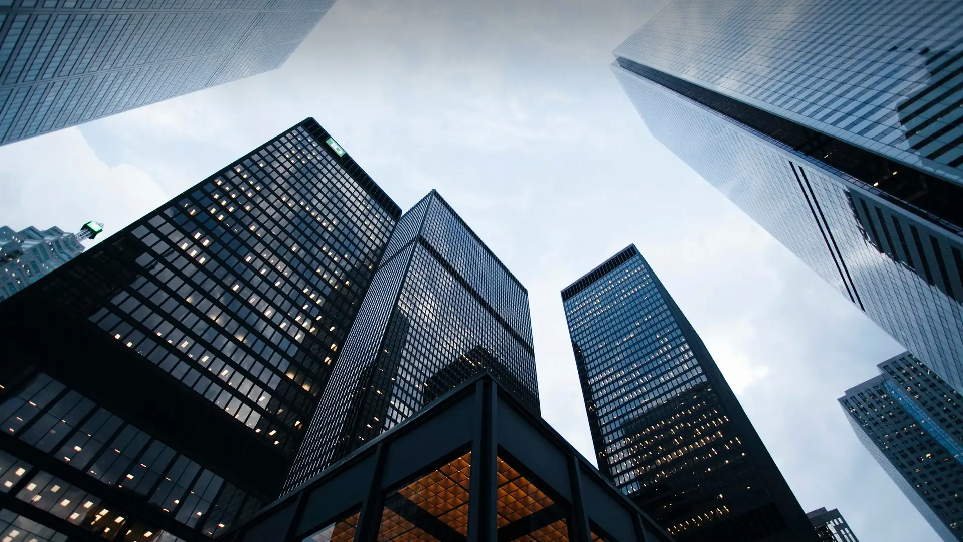 Skyscrapers under a cloudy sky.